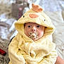 baby, pacifier, towel, yellow, hooded_towel, child, infant, cute, soft, plush, face, hand, indoor, person, portrait, clothing, bed, blanket, comfort, warm