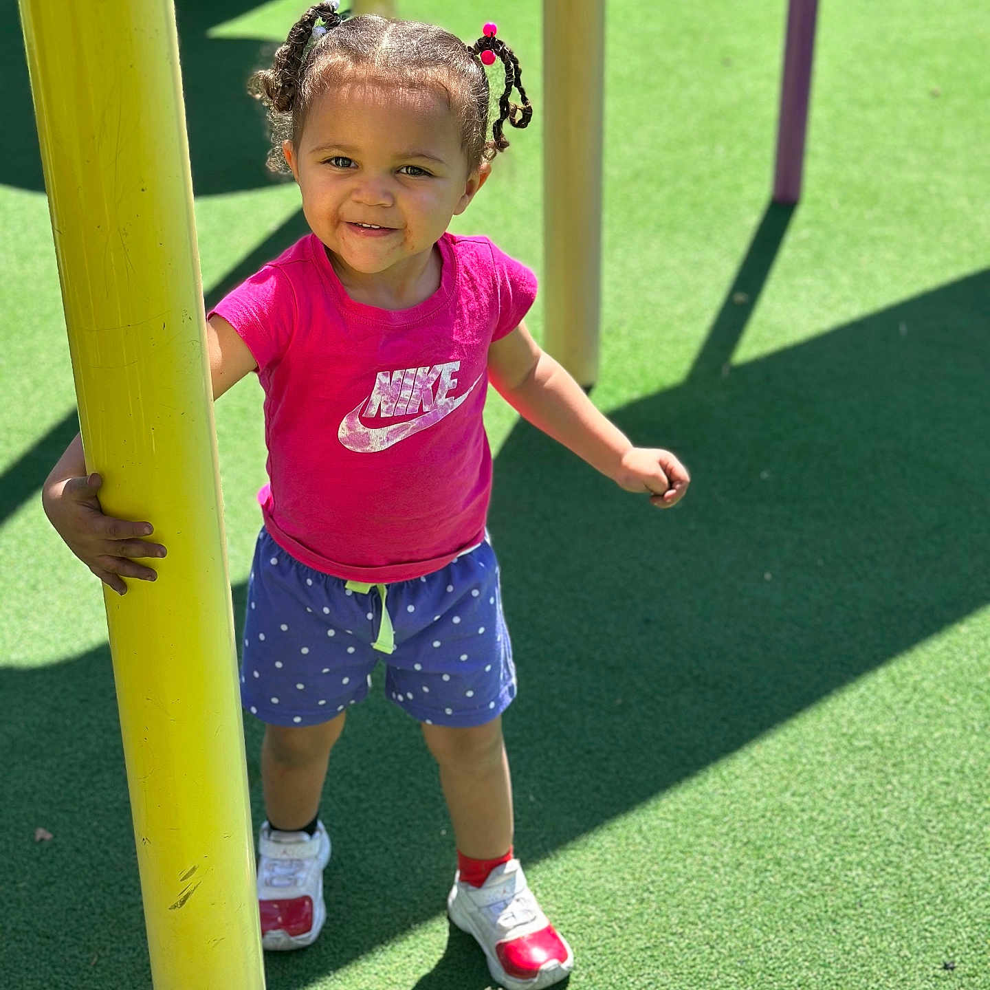 Karmen is registered to the contest to win money with this photo: child, clothing, face, female, footwear, girl, grass, head, nature, outdoorplayarea, outdoors, park, person, photography, plant, playarea, portrait, shoe, shorts, t_shirt