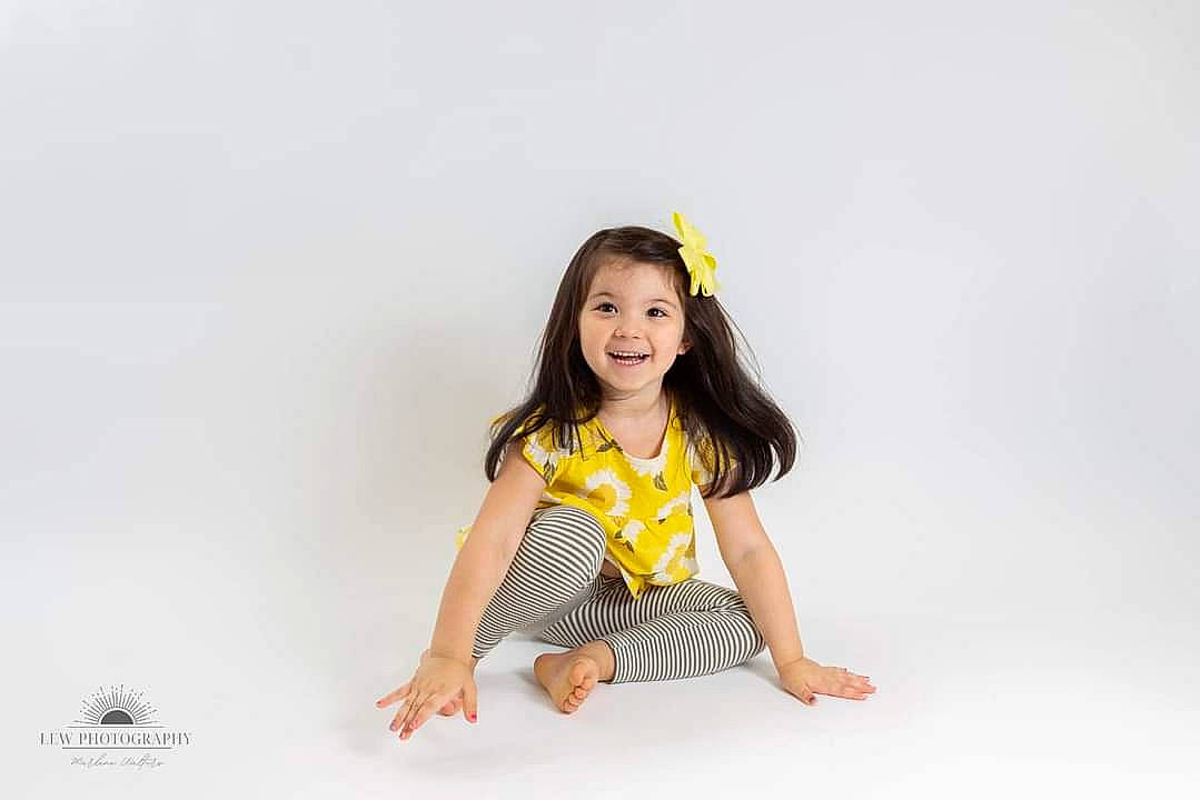 Angelica is registered to the contest to win money with this photo: arm, baby_toddler_clothing, elbow, eye, flash_photography, fun, gesture, hair, hand, happy, human_body, joy, leg, neck, outerwear, person, shirt, sleeve, smile, t_shirt