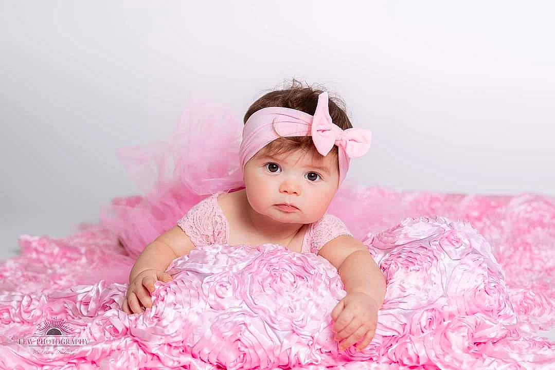 Kaliopi joined the competition — help win amazing prizes! baby, baby_toddler_clothing, child, costume, day_dress, dress, embellishment, fashion_accessory, flash_photography, happy, headpiece, headwear, magenta, pattern, peach, person, pink, purple, ruffle, sitting