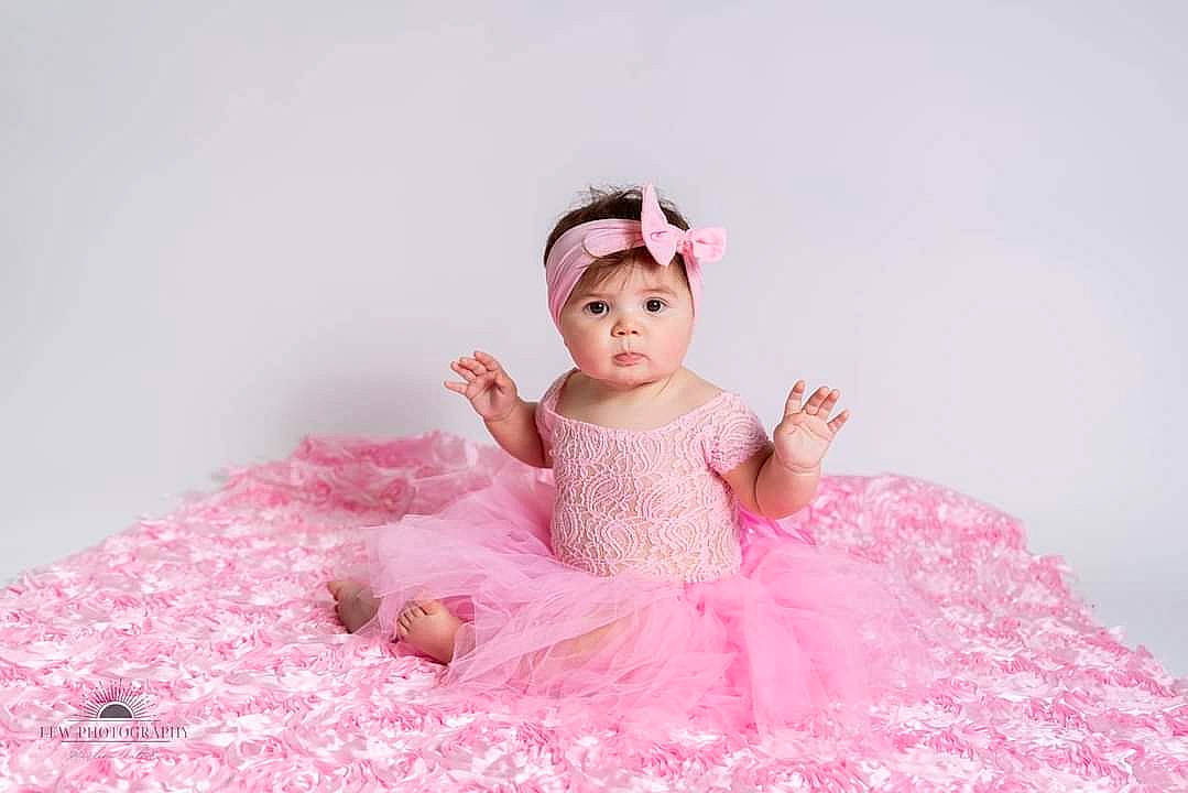 Kaliopi joined the competition — help win amazing prizes! baby_toddler_clothing, day_dress, dress, embellishment, eye, eyelash, fashion_accessory, fashion_design, hair_accessory, head, headpiece, headwear, magenta, mythical_creature, pattern, peach, person, petal, pink, ruffle