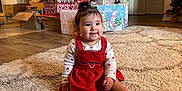 Leiana joined the competition — help win amazing prizes! child, toddler, baby, christmas_tree, presents, gifts, red_dress, rug, living_room, holiday, smile, socks, wood_floor, ornaments, stockings, wrapped_gifts, indoor, portrait, happy, festive