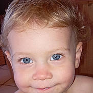 Calie participe au concours pour gagner de l'argent avec cette photo : baby, blue_eyes, cheek, child, close_up, curly_hair, cute, eyelashes, face, happy, head, indoors, mouth, nose, person, portrait, skin, smile, toddler, young_child