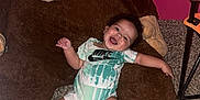 Messiah joined the competition — help win amazing prizes! baby, smiling, plush_toy, giant_monkey, carpet, pink_wall, onesie, happy, indoor, child, toy, cute, person, infant, playful, room, floor, toddler, clothing, furniture