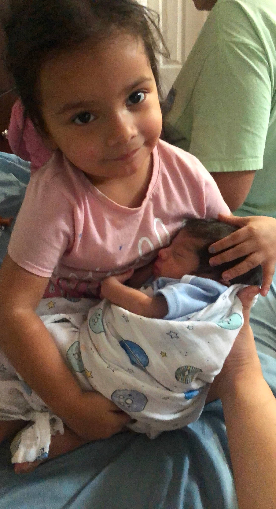 Alexis is registered to the contest to win money with this photo: baby, baby_products, baby_toddler_clothing, bib, cheek, child, comfort, elbow, eye, face, happy, head, human, joy, lap, mouth, person, sitting, skin, sleeve