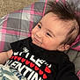 Waylon is registered to the contest to win money with this photo: baby, infant, smiling, smile, baby_seat, plaid_pattern, black_tshirt, valentine_shirt, hearts, hair_spikes, cheeks, hand, blanket, carpet, indoor, portrait, cute, close_up, young_child, happy