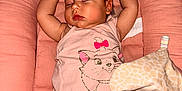 Alma a rejoint le concours — aidez-le/la à gagner de superbes lots ! baby, sleeping, diaper, pink, plush_toy, giraffe, infant, cute, cozy, cushion, clothing, toddler, child, face, arms_up, resting, indoors, soft, peaceful, naptime