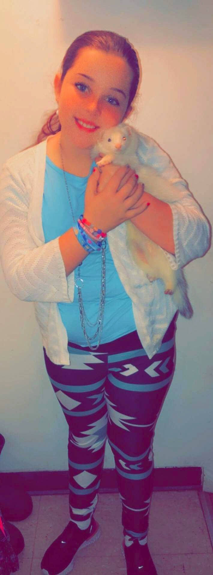 Miranda is registered to the contest to win money with this photo: abdomen, beard, chest, elbow, electric_blue, gesture, human_body, joint, joy, nail, neck, person, pink, plastic_bottle, purple, shoulder, sleeve, sportswear, thigh, trunk