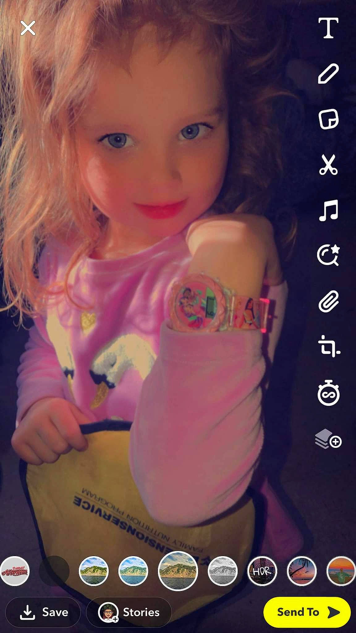 Khloe is registered to the contest to win money with this photo: arm, cheek, child, doll, eyebrow, eyelash, finger, gesture, hand, happy, iris, lip, long_hair, magenta, mouth, nail, person, pink, skin, smile