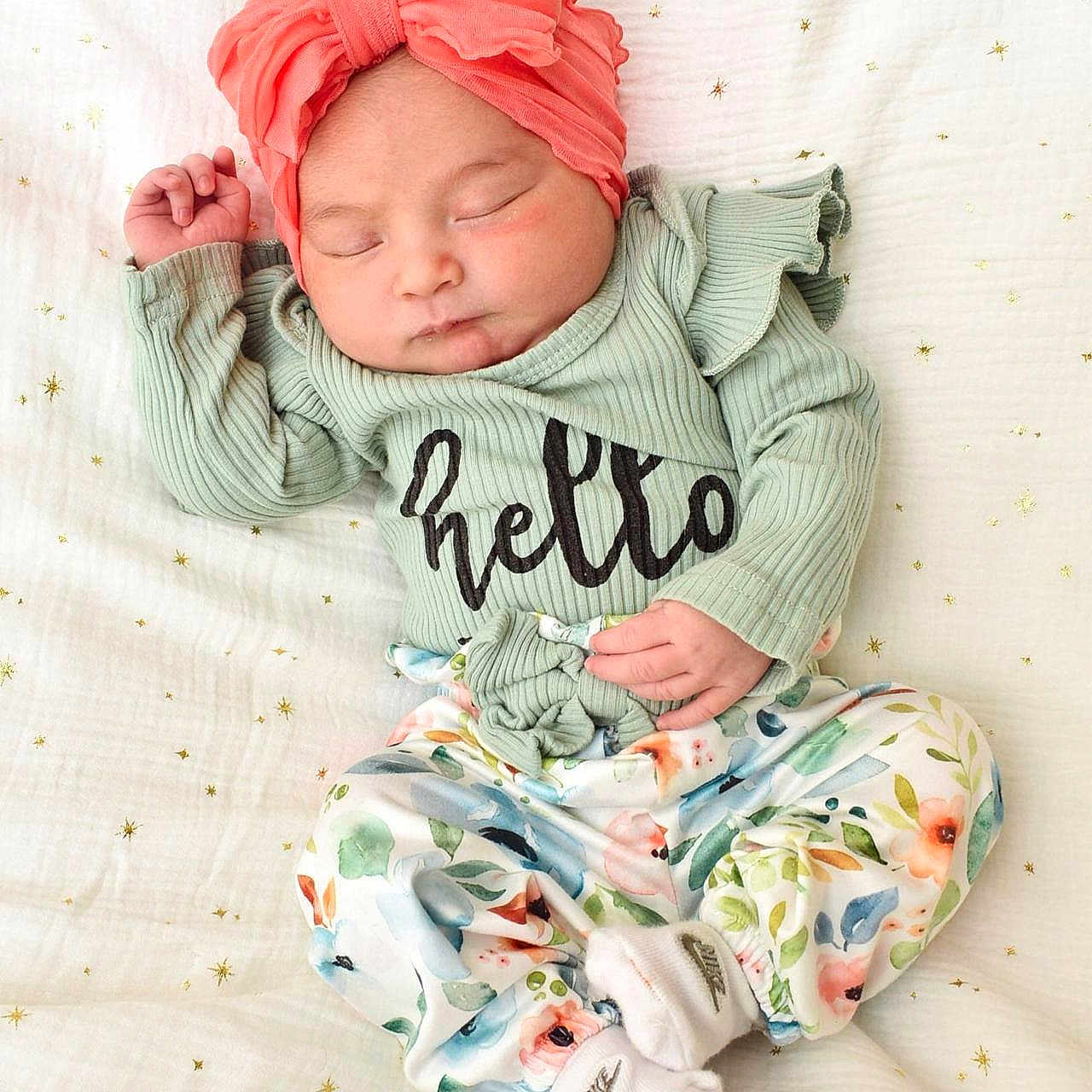 Samara Rose Becerra is registered to the contest to win money with this photo: adorable, baby, child, clothing, coral, cozy, cute, floral_pants, golden_stars, headwrap, infant, mint_green, newborn, peaceful, portrait, resting, sleeping, small, soft, white_blanket