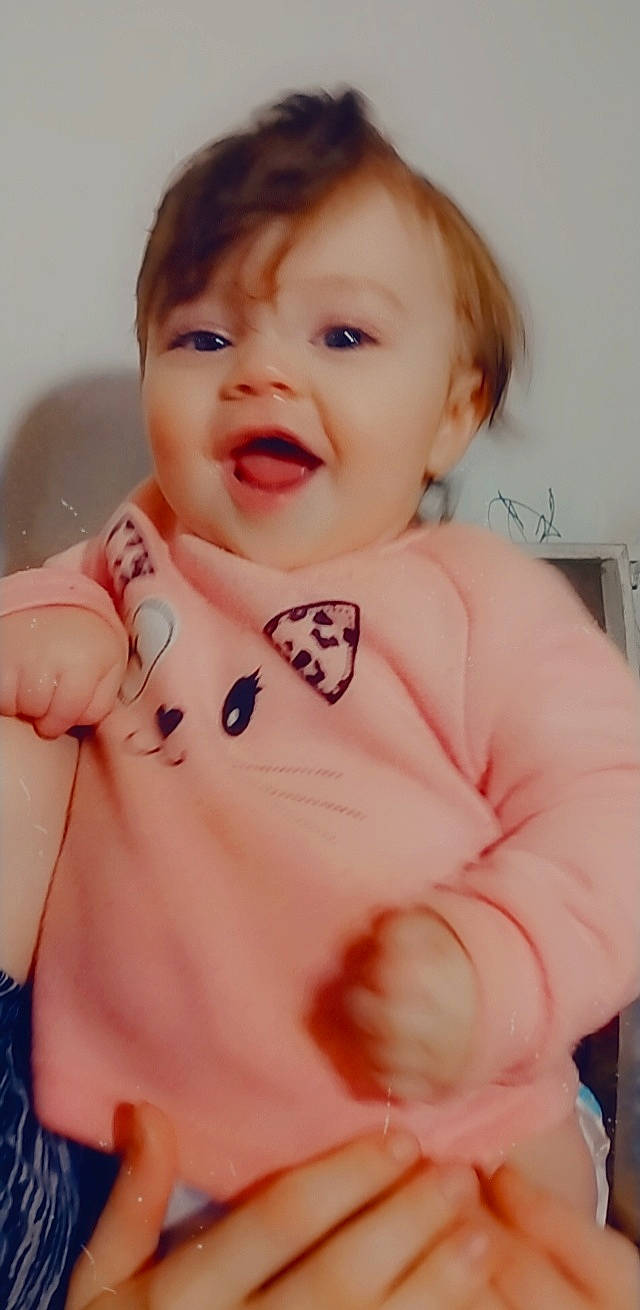 Blakley is registered to the contest to win money with this photo: arm, baby, baby_toddler_clothing, cheek, chest, eyebrow, finger, gesture, happy, iris, lip, mouth, neck, nose, person, skin, sleeve, smile, stomach, thumb