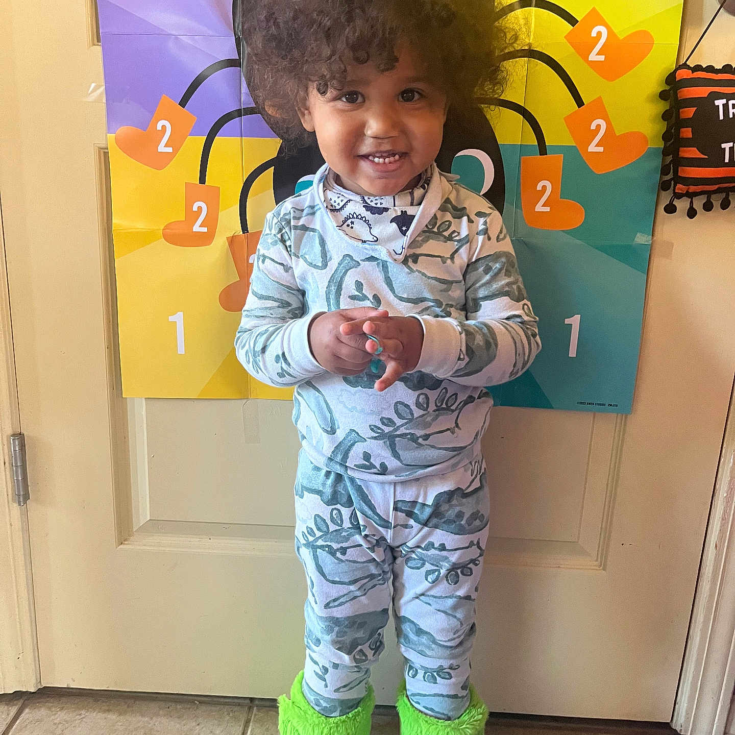 Zaiden is registered to the contest to win money with this photo: accessories, baby, bag, bodypart, clothing, face, finger, hair, hand, handbag, head, hosiery, pajamas, pants, person, photography, portrait, sleeve, sock, text