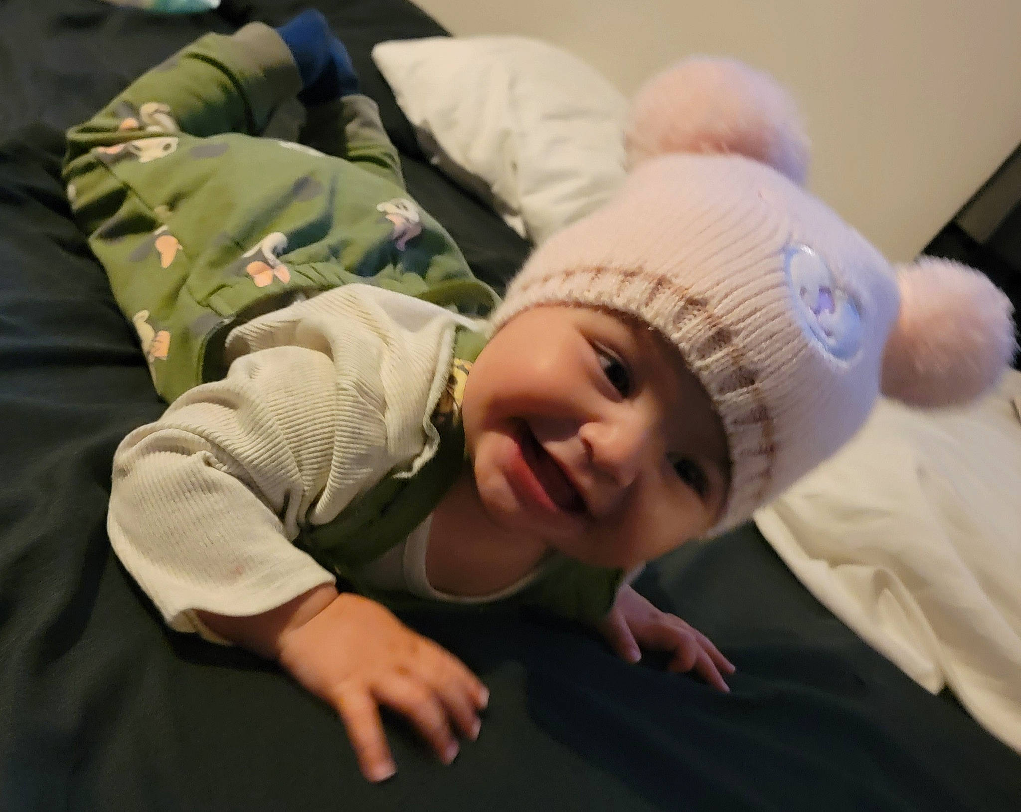 Zaylee joined the competition — help win amazing prizes! baby, baby_toddler_clothing, beanie, cap, cheek, child, comfort, flash_photography, flooring, fun, gesture, grass, happy, hat, headgear, headwear, person, portrait_photography, room, sitting