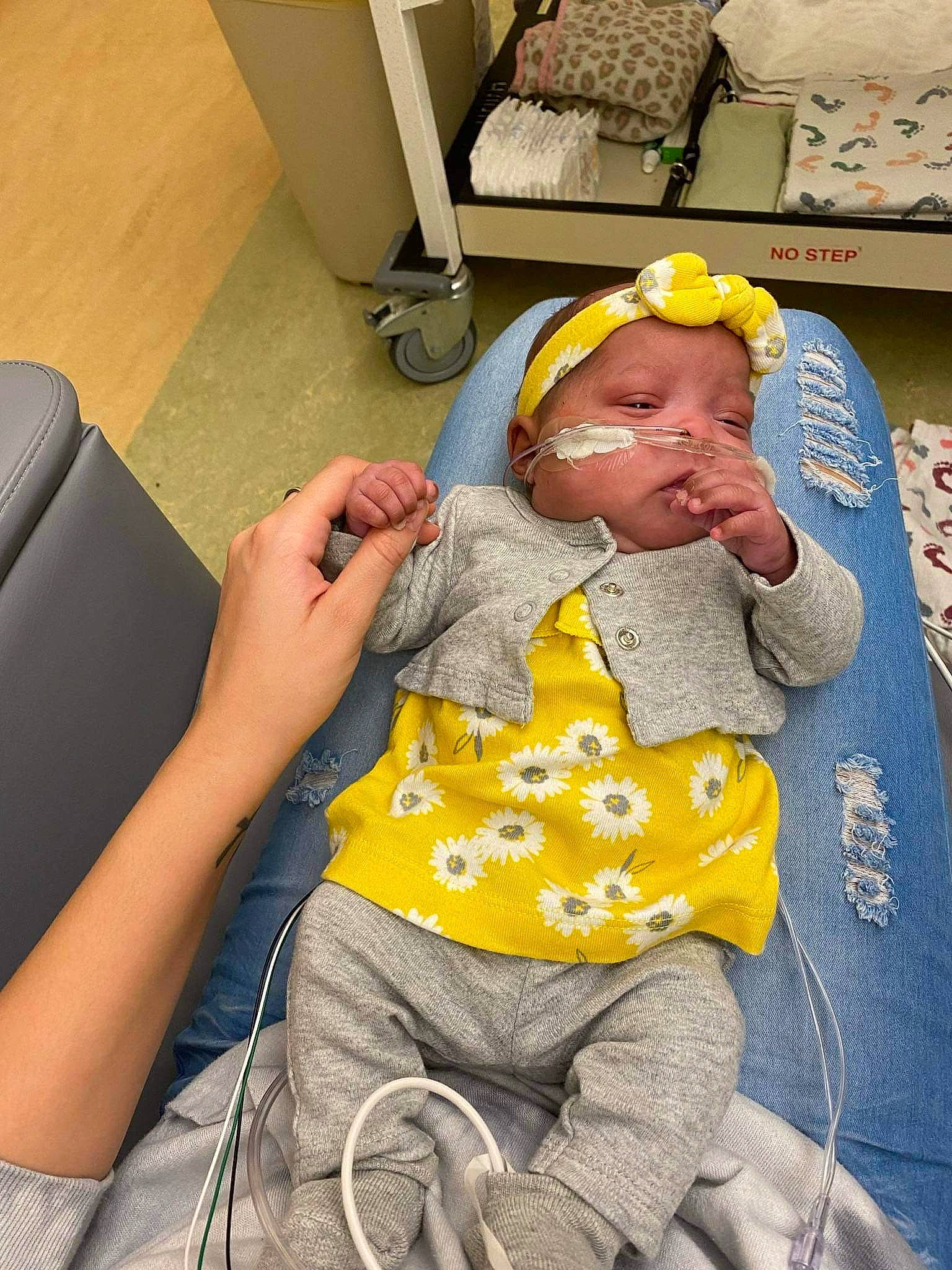 Kataleya joined the competition — help win amazing prizes! baby, cap, chair, child, comfort, flooring, flower, fun, human_leg, knee, lap, leisure, person, room, sitting, t_shirt, thigh, toddler, wheelchair, wrist