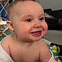 Indie joined the competition — help win amazing prizes! baby, child, smiling, face, eyes, cheeks, skin, expression, indoors, toy, living_room, furniture, clothing, person, cute, happy, infant, headwear, closeup, portrait