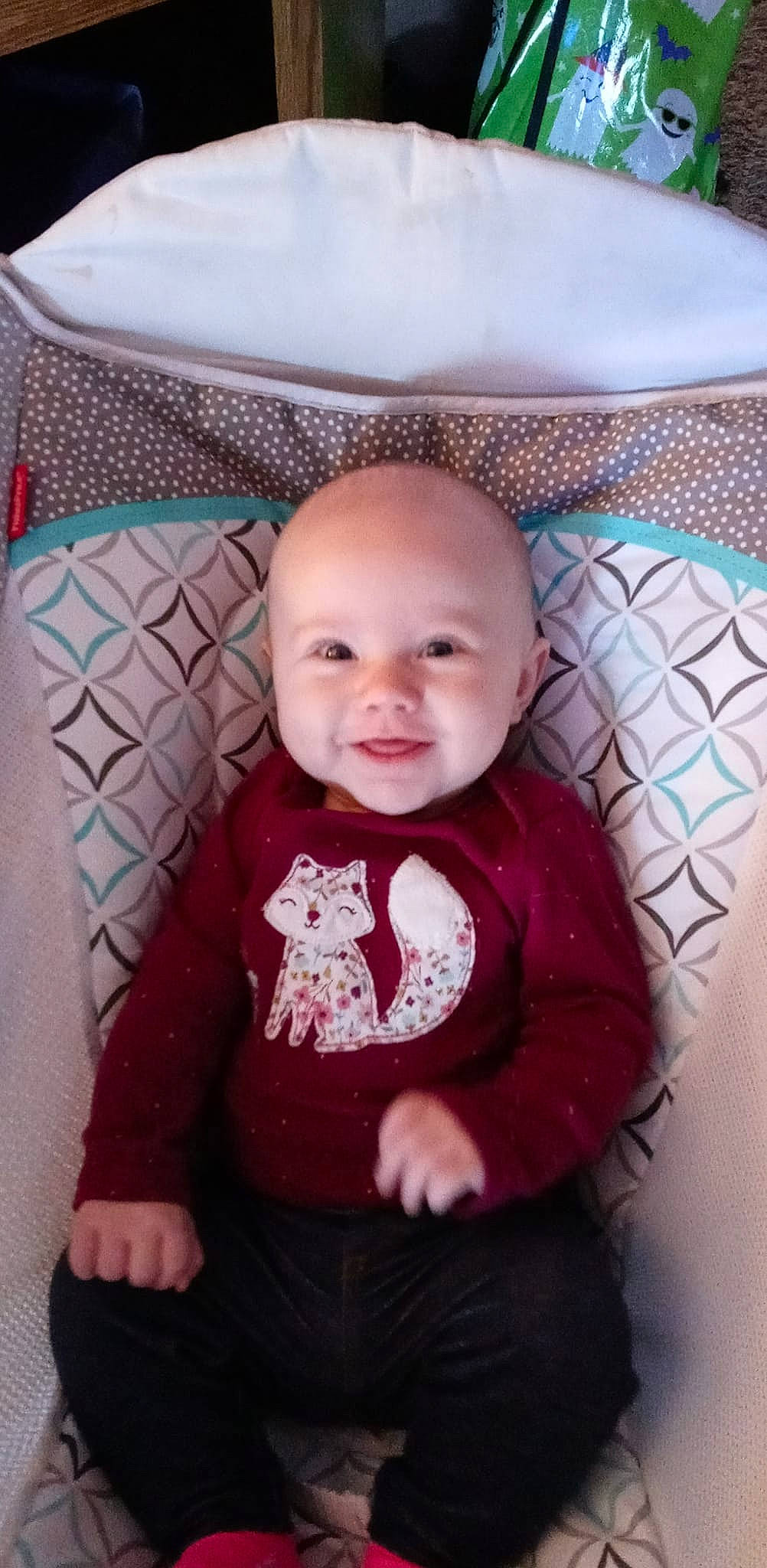 Jaelynn is registered to the contest to win money with this photo: baby, baby_toddler_clothing, cheek, child, chin, comfort, eye, iris, joy, linens, magenta, mouth, organ, pattern, person, pink, product, skin, sleeve, smile