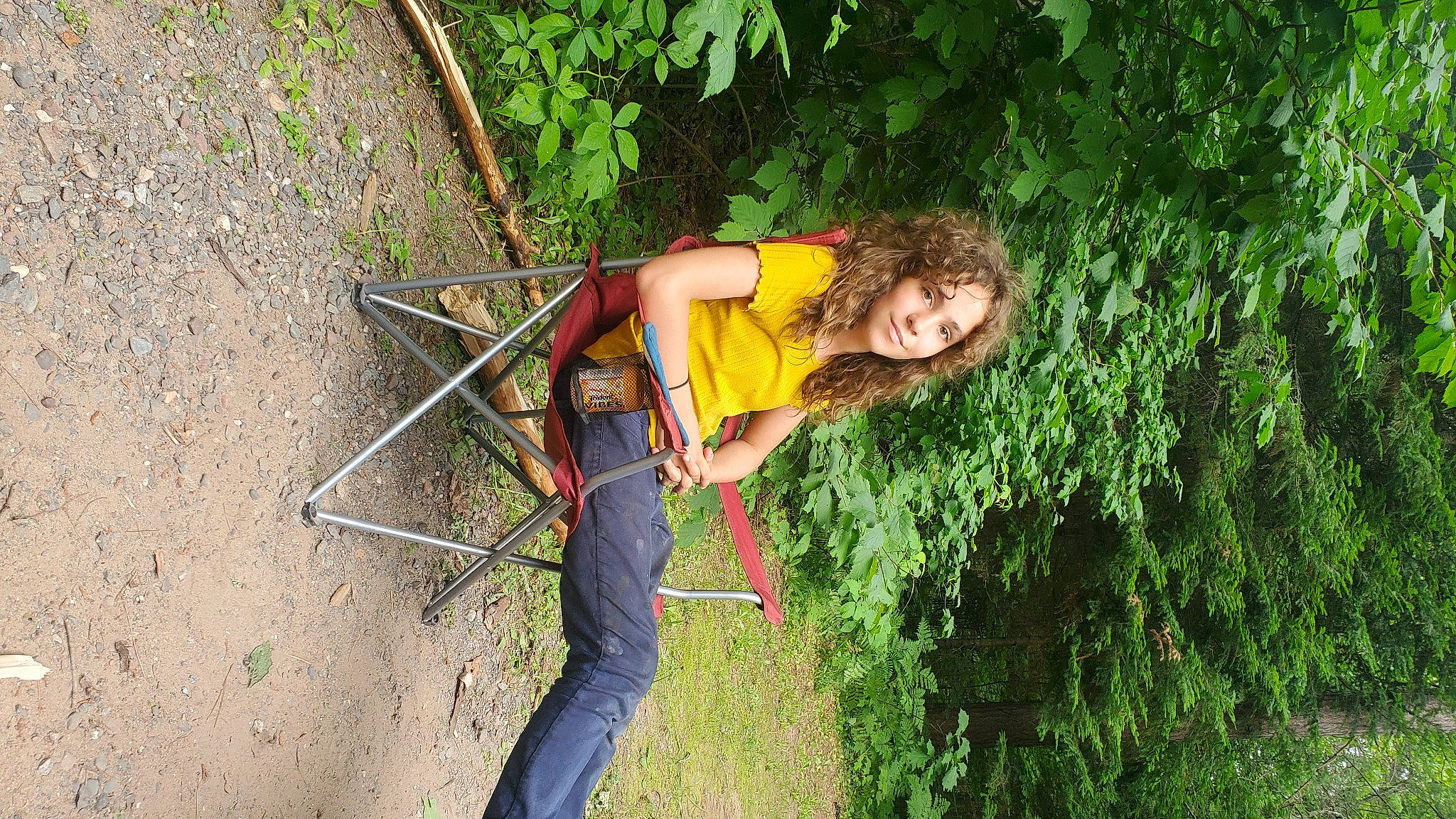 Clarissa Jones is registered to the contest to win money with this photo: adventure, chair, climbing_harness, electric_blue, fun, grass, joy, jungle, leisure, people_in_nature, person, plant, recreation, rock_climbing_equipment, rope, shrub, smile, soil, sport_climbing, t_shirt