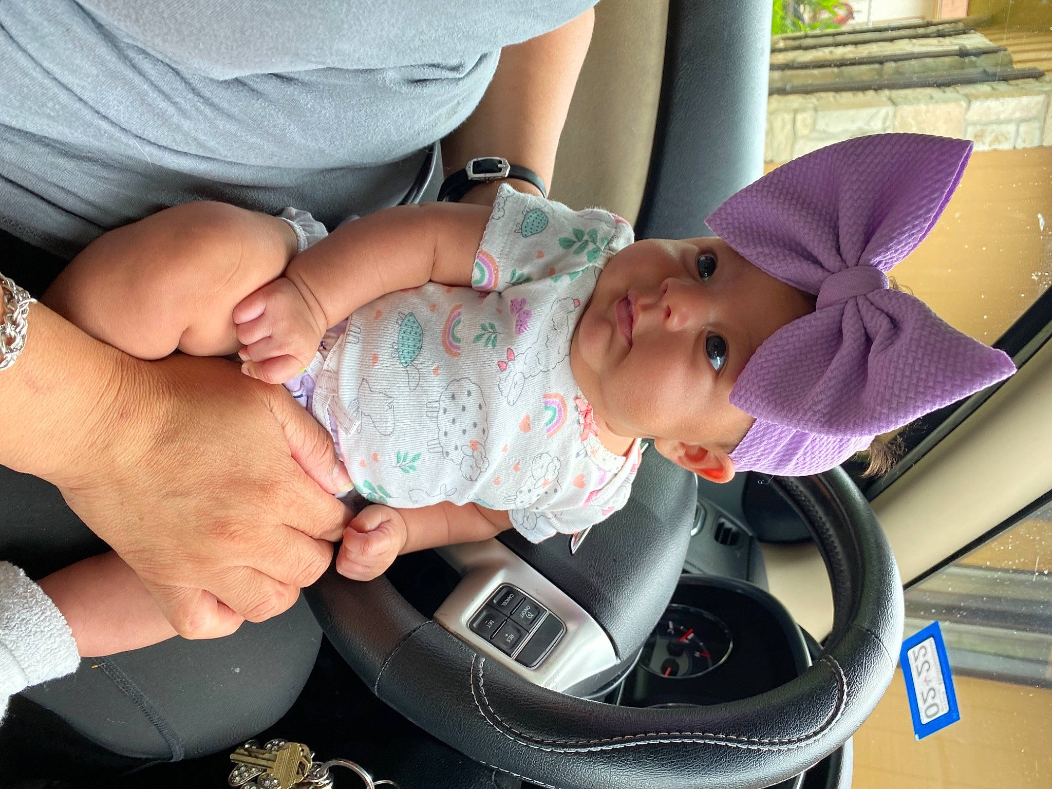 Leticia is registered to the contest to win money with this photo: baby, baby_products, baby_toddler_clothing, carmine, child, comfort, fashion_accessory, finger, gesture, hand, hat, headwear, nail, person, personal_protective_equipment, pink, product, sitting, skin, thumb
