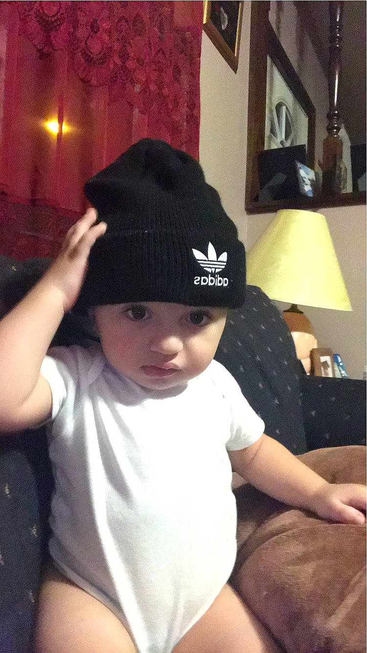 Emir is registered to the contest to win money with this photo: beanie, bonnet, cap, child, clothing, cool, headgear, headwear, knit_cap, person, toddler