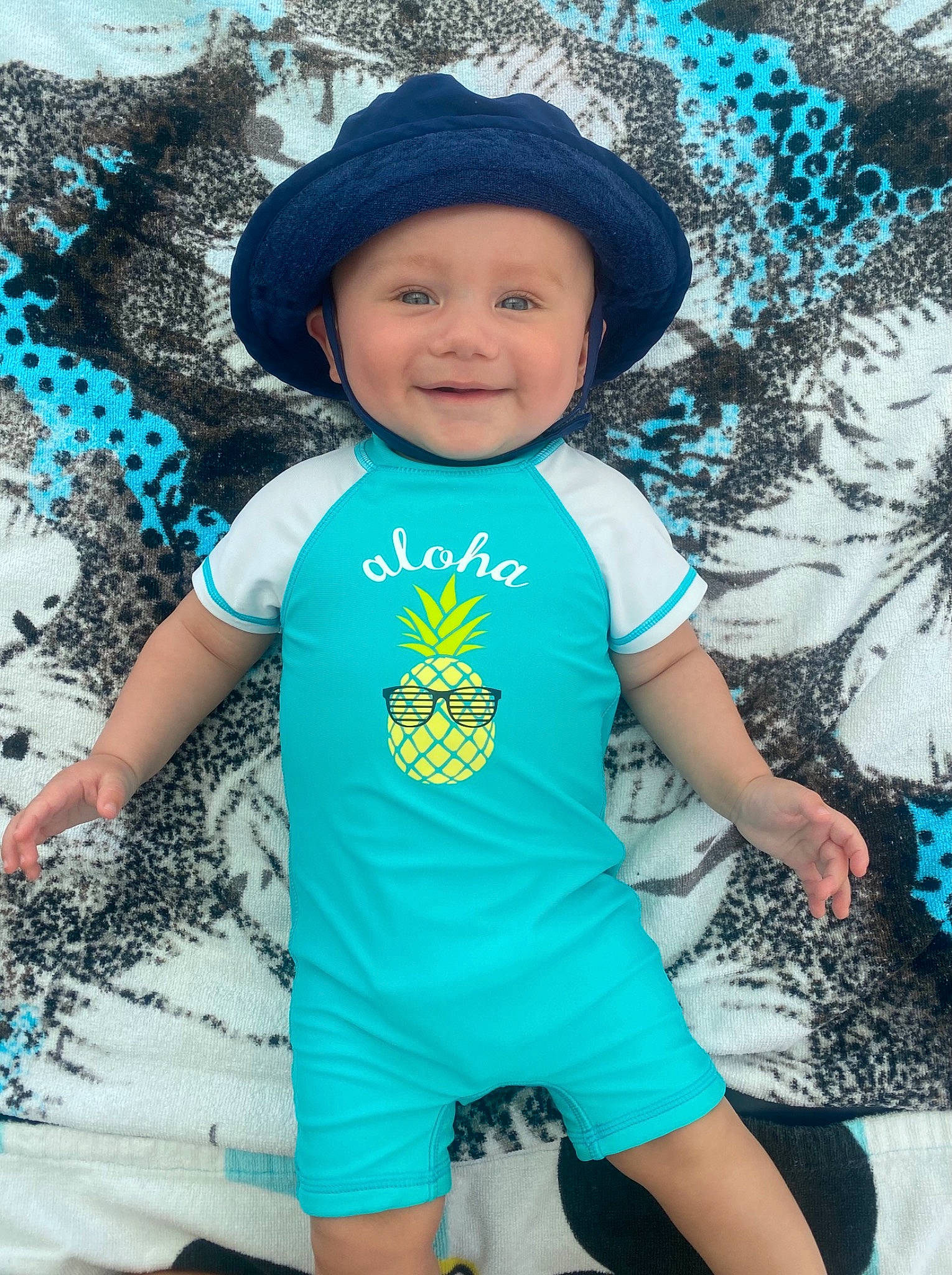 Graysen is registered to the contest to win money with this photo: azure, baby_toddler_clothing, blue, cap, eye, face, green, hairstyle, happy, hat, headgear, headwear, human_body, joy, outerwear, people_in_nature, person, photograph, sleeve, smile
