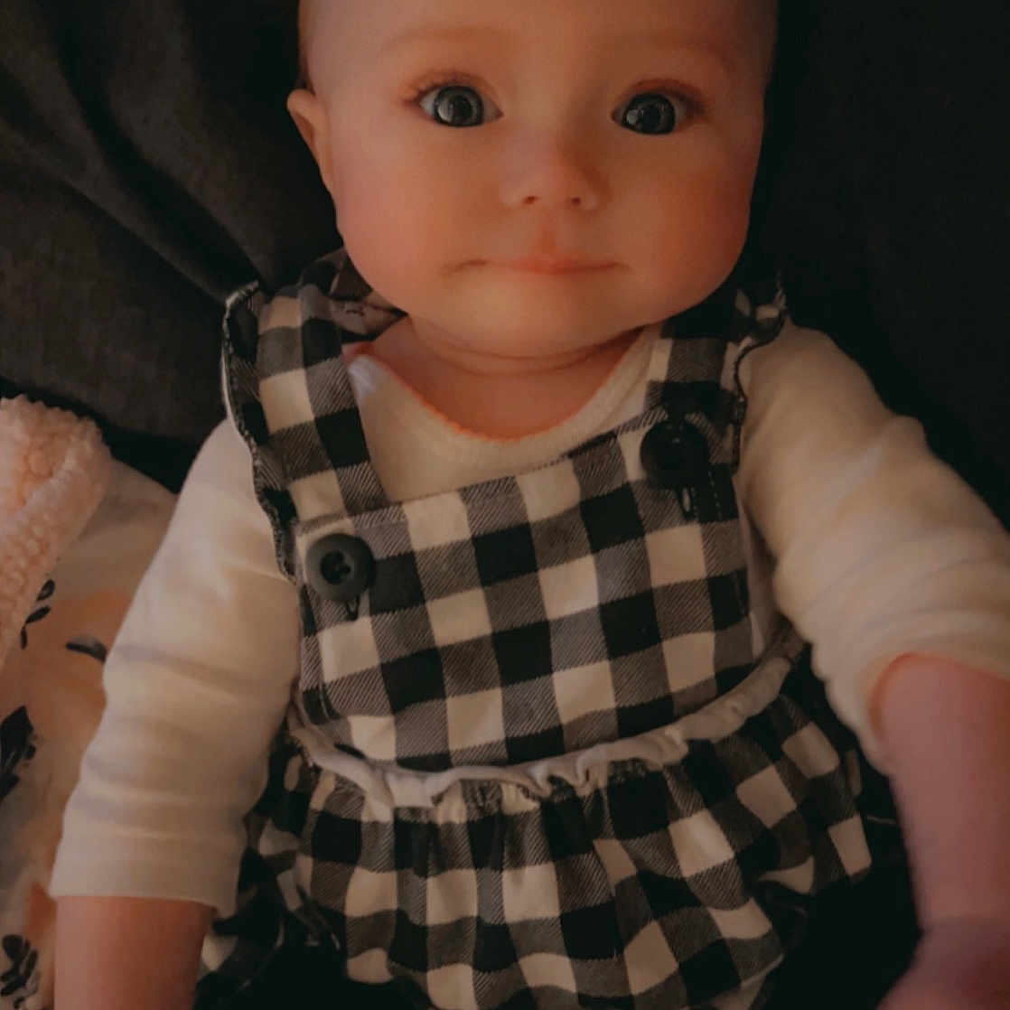 Julianne is registered to the contest to win money with this photo: baby, baby_toddler_clothing, cheek, chest, collar, dress_shirt, eyelash, flash_photography, gesture, iris, lip, neck, pattern, plaid, sleeve, t_shirt, tartan, thumb, toddler, trunk