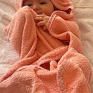 Delia joined the competition — help win amazing prizes! baby, towel, blanket, peach, wrapped, face, infant, soft, cute, child, bed, animal_print, dalmatian, pattern, hand, skin, cozy, lying, comfort, rest