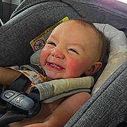 Teddy is registered to the contest to win money with this photo: baby, baby_face, candid, car_interior, car_seat, child, child_safety, childhood, closeup, cute, happy, indoors, infant, portrait, rosy_cheeks, safety_harness, seat_headrest, seatbelt, smiling, toddler
