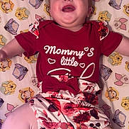 Shelbie is registered to the contest to win money with this photo: baby, bedroom, blanket, cartoon_pattern, child, cute, face, floral_romper, hair_tuft, happy, laughing, lying_down, onesie, pink_leggings, pooh_pattern, portrait, red_outfit, sheet, smiling, winnie_the_pooh