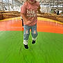 Everly is registered to the contest to win money with this photo: active, big_sister, blonde_hair, bounce_pad, casual_clothing, child, fun, greenhouse, happy, hay_bales, indoor, inflatable, jeans, jumping, lace, person, play, smiling, sock_feet, tshirt