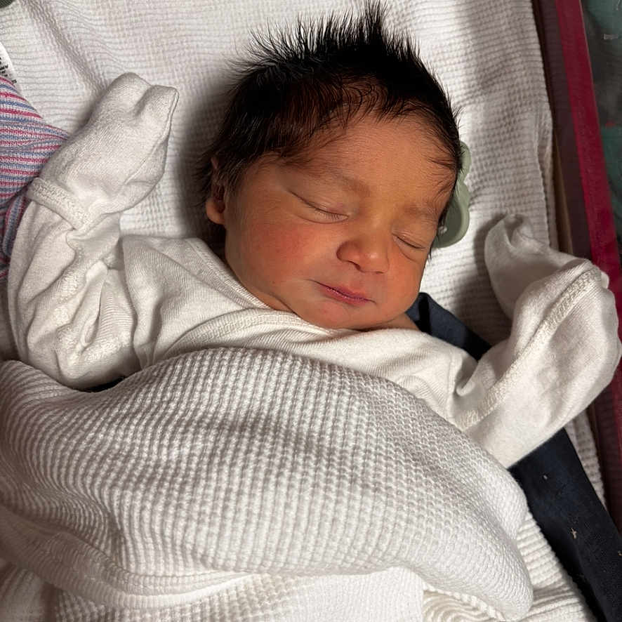 Draven is registered to the contest to win money with this photo: baby, blanket, child, closeup, cozy, cute, face, hair, indoors, infant, newborn, peaceful, portrait, rest, sleeping, soft, tiny, warm, white, wrapped