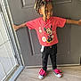 Nene is registered to the contest to win money with this photo: child, girl, standing, indoors, door, pink_shirt, minnie_mouse, black_pants, pink_bow, shoes, shoelaces, hair, curly_hair, light, floor, window, casual_clothing, expression, pose, young