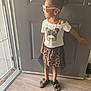 Nene is registered to the contest to win money with this photo: child, girl, standing, door, leopard_print, skirt, hair_bow, sunglasses, white_tshirt, black_shoes, floor, indoor, light, window, pose, fashion, casual, young, cute, accessories