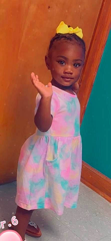 Jariyah is registered to the contest to win money with this photo: arm, baby_toddler_clothing, day_dress, dress, eye, fashion_design, hand, happy, human_body, iris, lip, neck, one_piece_garment, person, pink, shoulder, sleeve, thigh, toddler, trunk