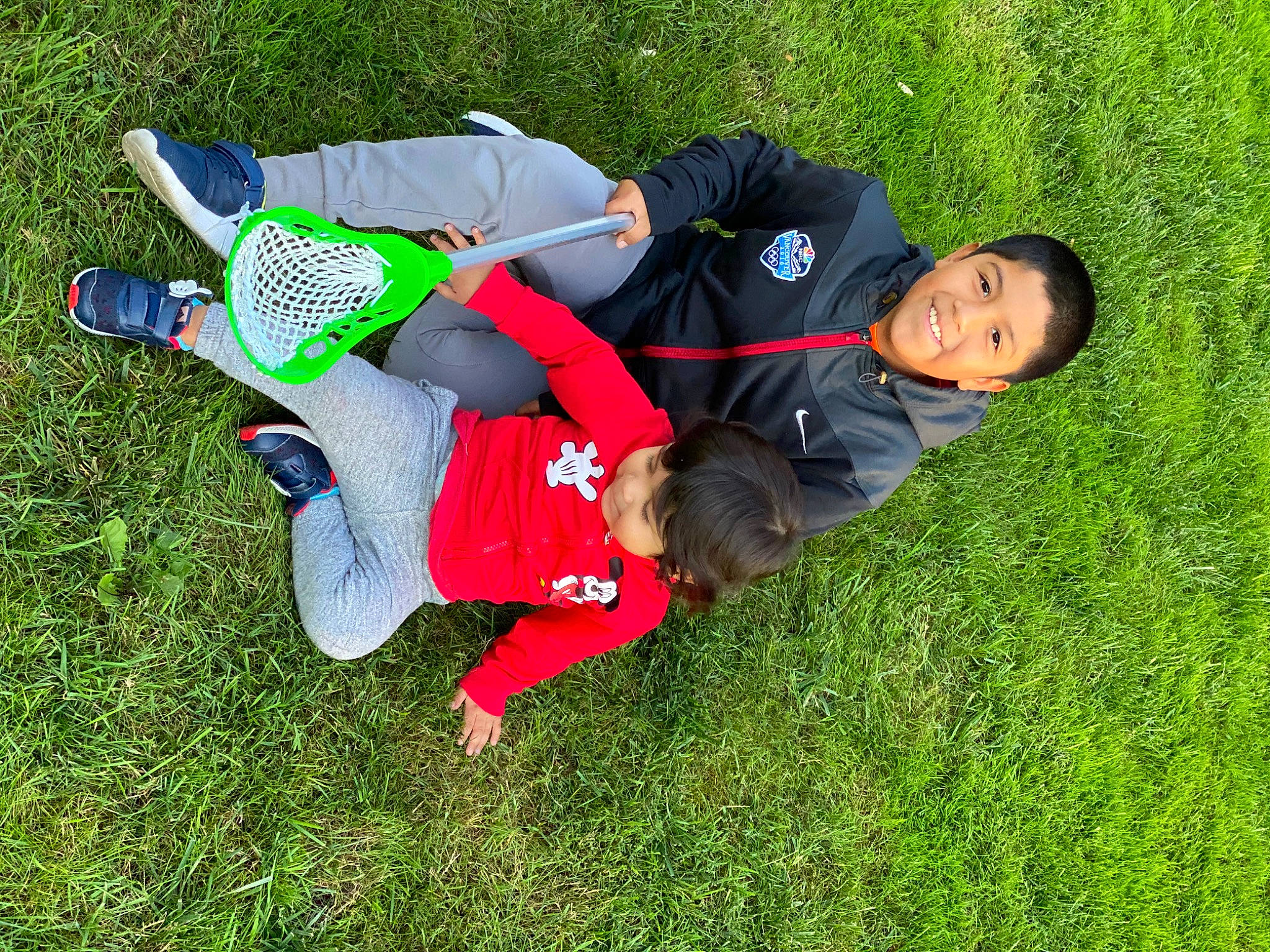 Josh is registered to the contest to win money with this photo: child, fun, grass, grassland, groundcover, happy, joy, lawn, leisure, meadow, pasture, people_in_nature, person, plant, recreation, shrub, smile, sneakers, t_shirt, toddler