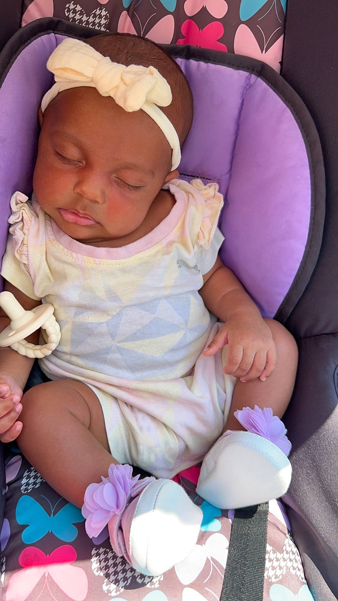 Alaysia joined the competition — help win amazing prizes! arm, baby, baby_products, baby_toddler_clothing, cap, comfort, dress, facial_expression, finger, hand, hat, headgear, headwear, leg, mouth, person, pink, purple, skin, textile