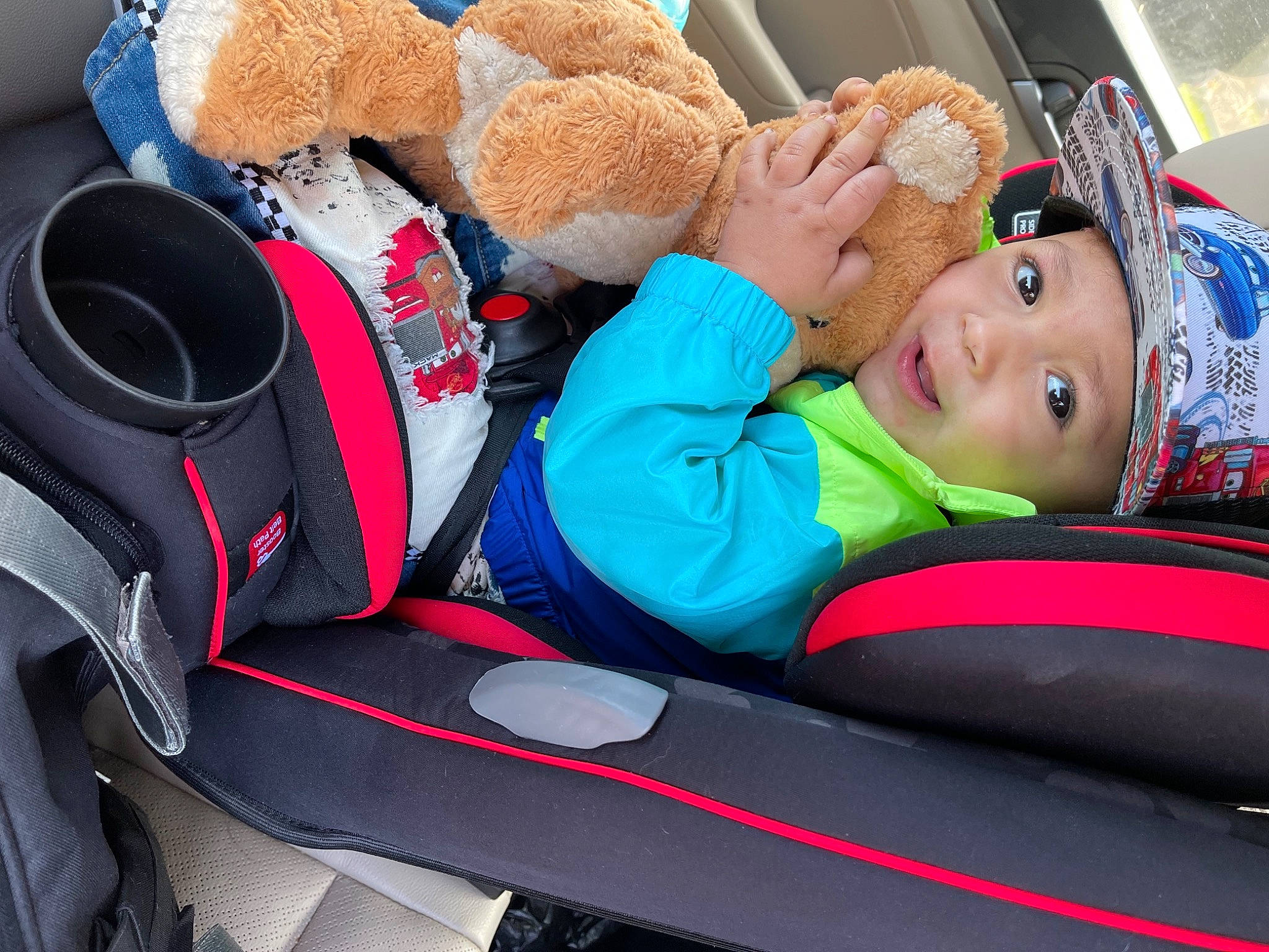 Kendryck joined the competition — help win amazing prizes! auto_part, automotive_design, baby, baby_carriage, baby_sleeping, car_seat, car_seat_cover, child, comfort, family_car, headwear, motor_vehicle, person, red, smile, steering_wheel, stuffed_toy, teddy_bear, toddler, toy