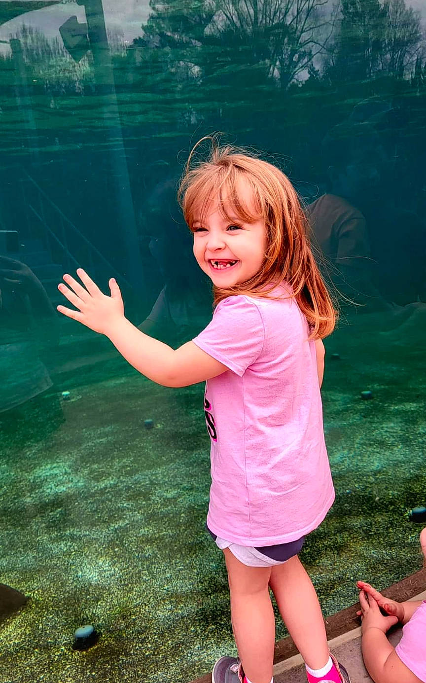 Kyndall is registered to the contest to win money with this photo: beauty, child, finger, flash_photography, fun, gesture, grass, grass_family, happy, joy, leisure, people_in_nature, person, pink, shoulder, skin, smile, standing, sunlight, toddler