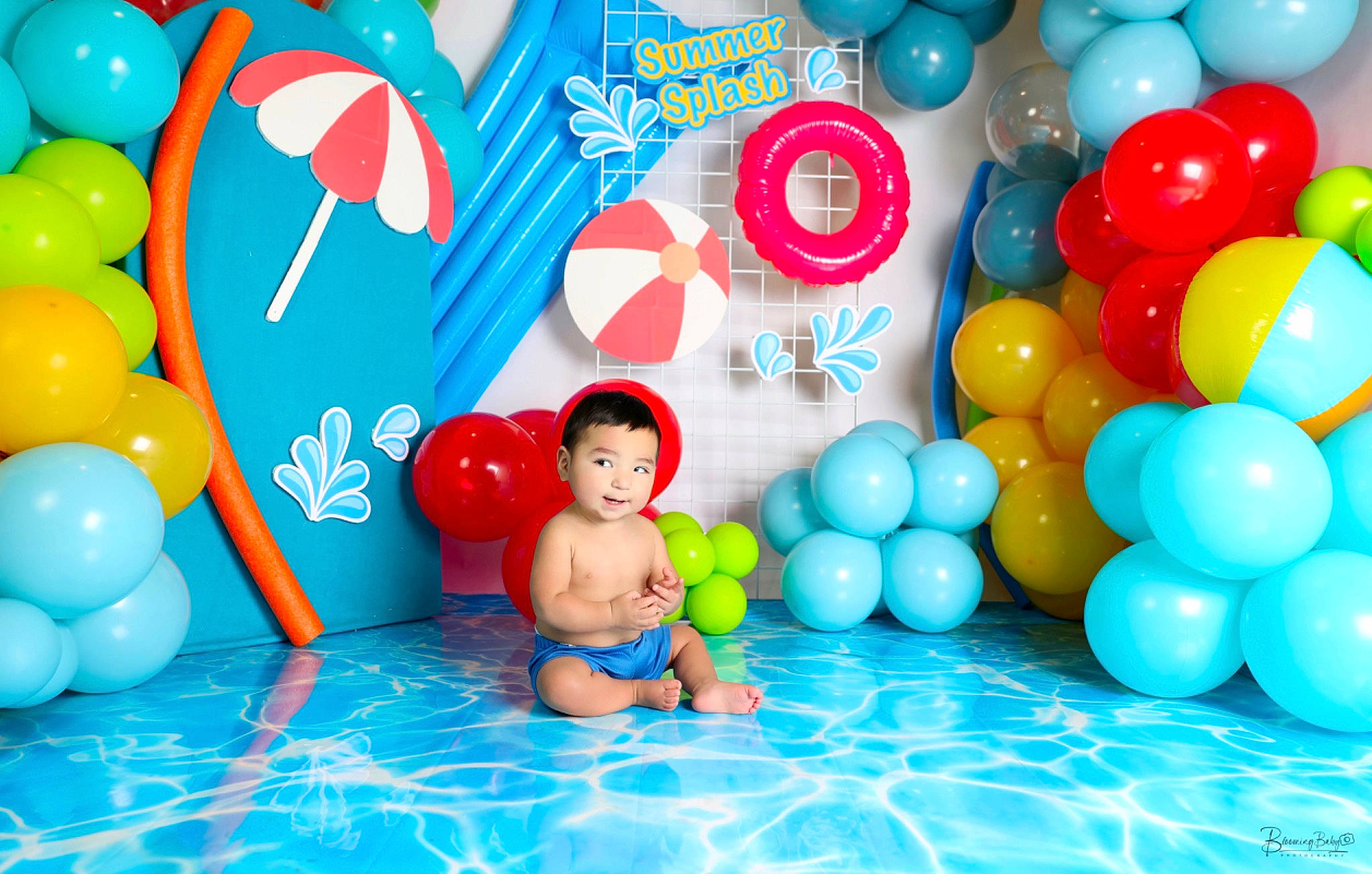 Elias is registered to the contest to win money with this photo: aqua, baby, balloon, blue, child, electric_blue, event, fun, happy, inflatable, leisure, party, party_supply, person, play, product, recreation, red, toddler, water