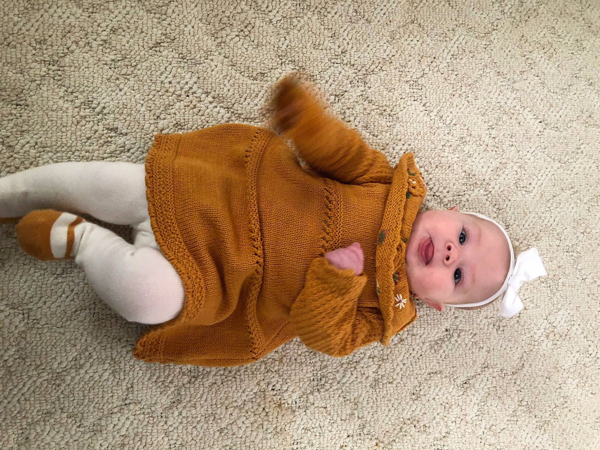 Lucie is registered to the contest to win money with this photo: baby, baby_toddler_clothing, child, comfort, fawn, flooring, fur, head, headgear, human_body, human_leg, knee, linens, person, sitting, skin, sleeve, toddler, wood, wool