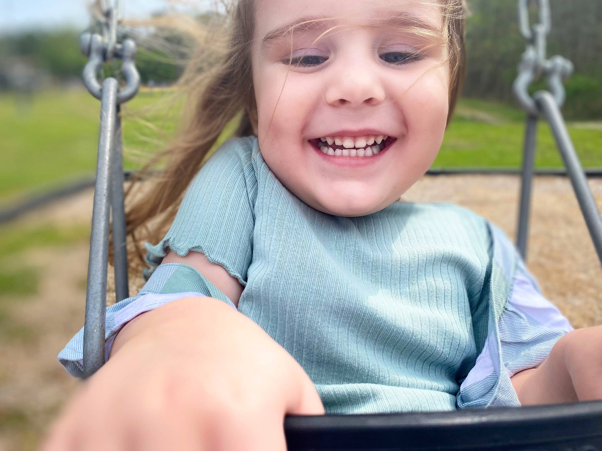 Emma is registered to the contest to win money with this photo: cheek, chin, eye, face, finger, fun, grass, hairstyle, hand, happy, headwear, iris, joy, leisure, people_in_nature, person, product, recreation, skin, smile