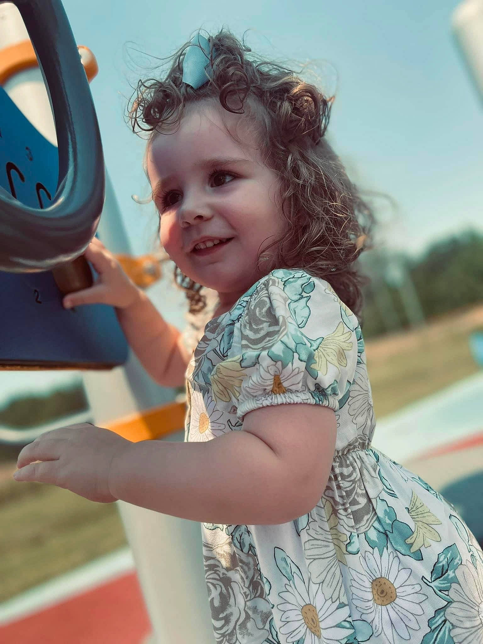 Emma joined the competition — help win amazing prizes! arm, child, chin, cool, electric_blue, fun, gesture, hair, hand, happy, joy, leisure, person, public_space, recreation, shoulder, skin, sky, smile, summer