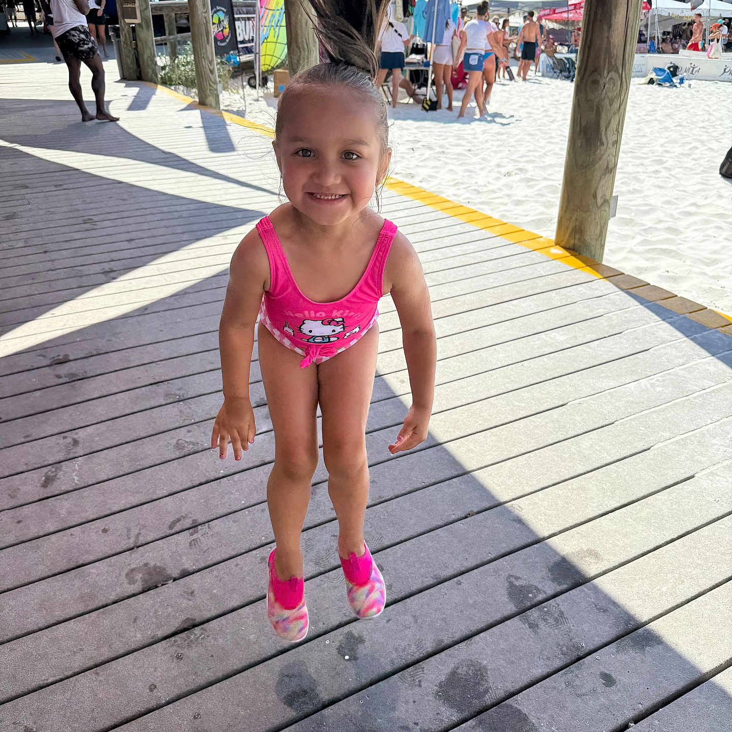 Dalaya joined the competition — help win amazing prizes! beach, boardwalk, child, footwear, fun, girl, hair, happy, hello_kitty, jumping, outdoor, people, pink, ponytail, sand, smiling, summer, sunny, swimsuit, vacation