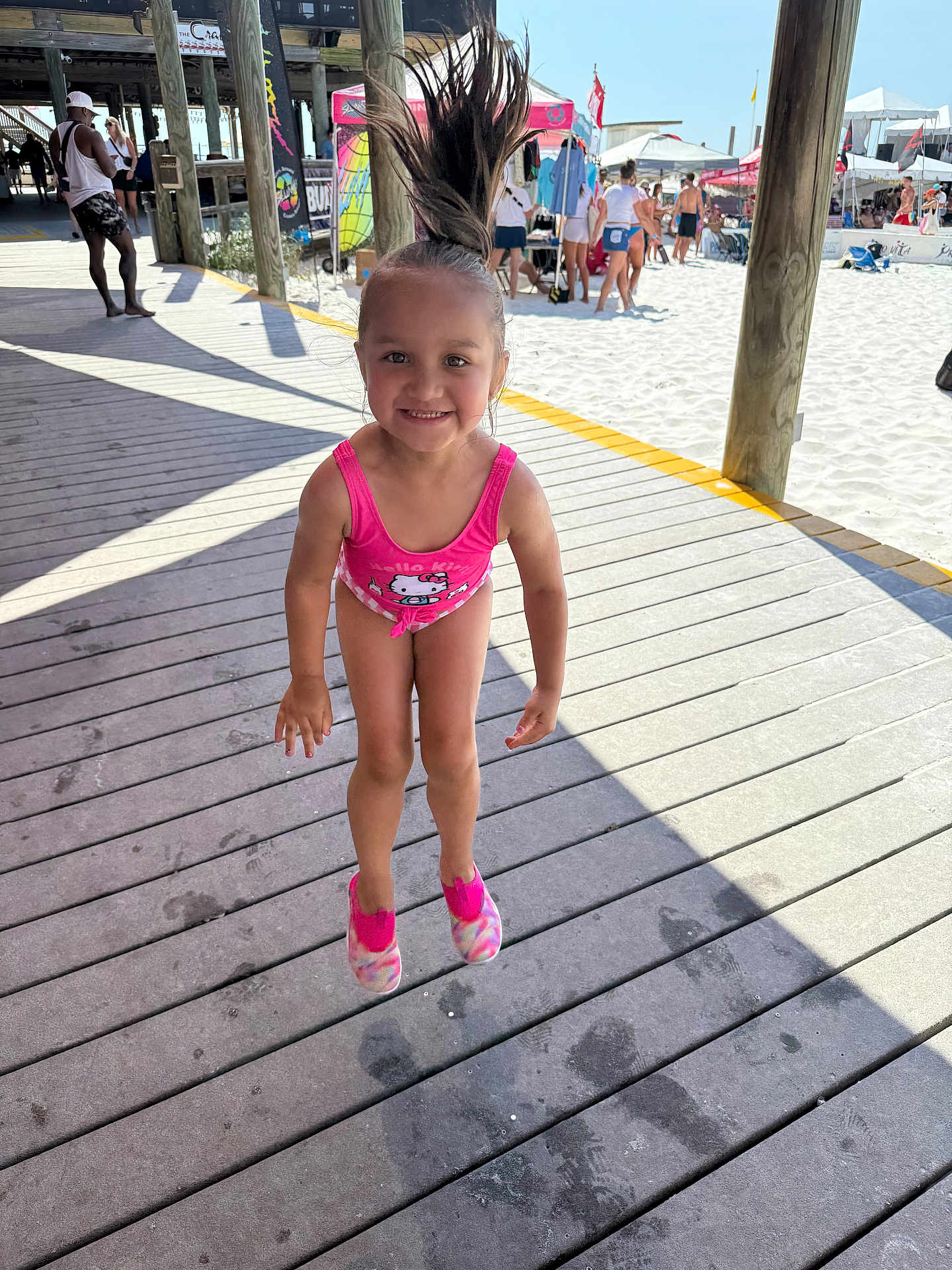 Dalaya joined the competition — help win amazing prizes! child, girl, jumping, smiling, swimsuit, pink, hello_kitty, hair, ponytail, beach, boardwalk, sunny, people, sand, summer, vacation, footwear, happy, outdoor, fun