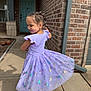 child, girl, dress, purple, butterfly, braids, hair, smile, sidewalk, shadow, brick_wall, door, outdoor, sunlight, sneakers, concrete, playful, twirling, happy, casual