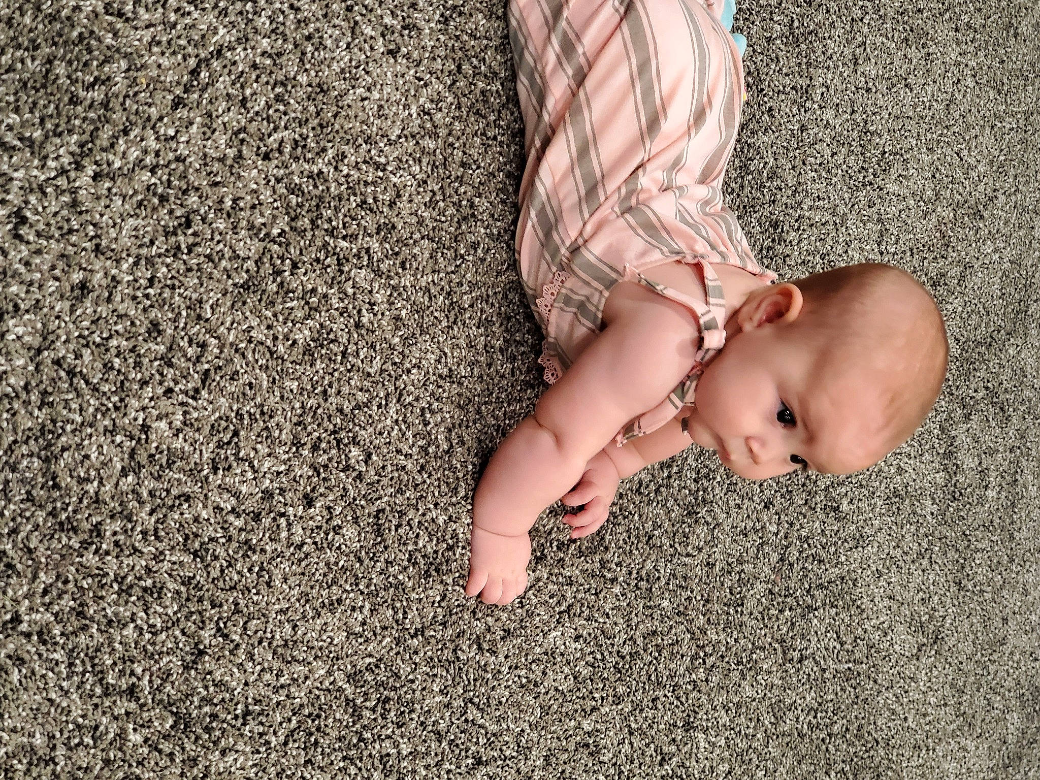 Briar is registered to the contest to win money with this photo: baby, barefoot, child, fawn, finger, floor, flooring, foot, grass, hand, human_leg, leg, person, photography, pink, plant, skin, toddler, toe
