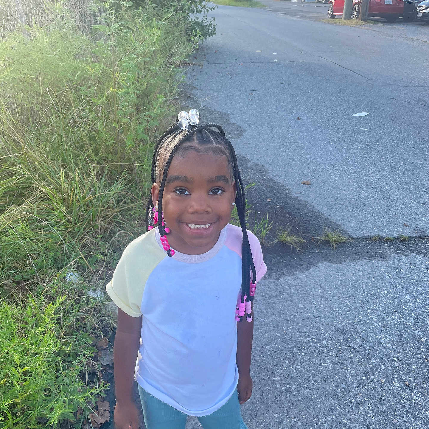 Amina joined the competition — help win amazing prizes! child, city, clothing, face, female, girl, head, pants, path, person, photography, plant, portrait, road, sidewalk, street, t_shirt, urban, vegetation, walking
