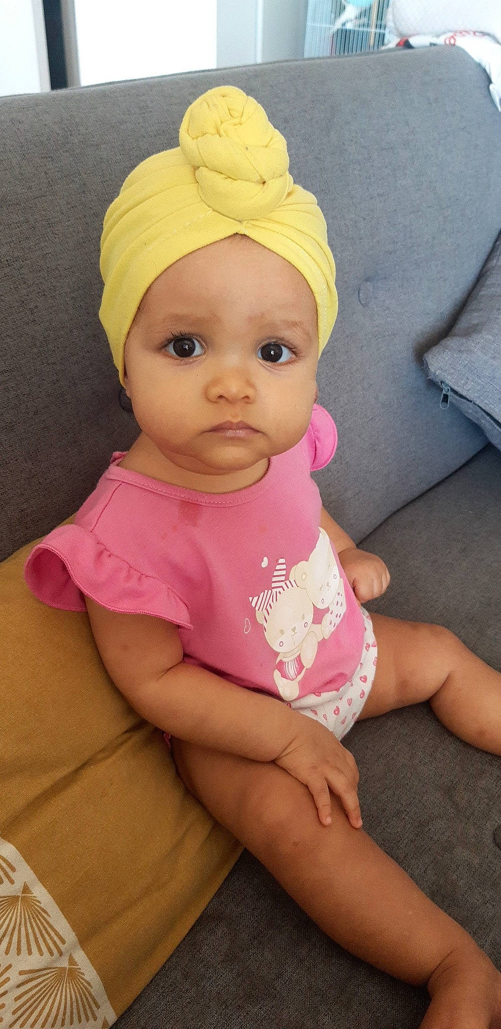 Ziyah participe au concours pour gagner de l'argent avec cette photo : baby, baby_toddler_clothing, cap, cheek, costume_hat, dress, eye, eyelash, hand, happy, headgear, headwear, human_body, lip, magenta, nose, outerwear, person, pink, skin