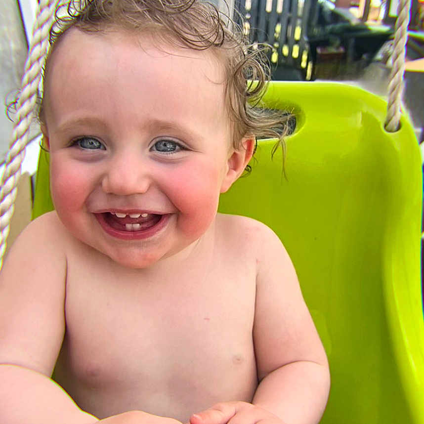 Victor a rejoint le concours — aidez-le/la à gagner de superbes lots ! baby, balcony, child, curly_hair, diaper, face, hand, happy, lake, nature, outdoor, playground, railing, seat, smiling, summer, sunlight, swing, toddler, water