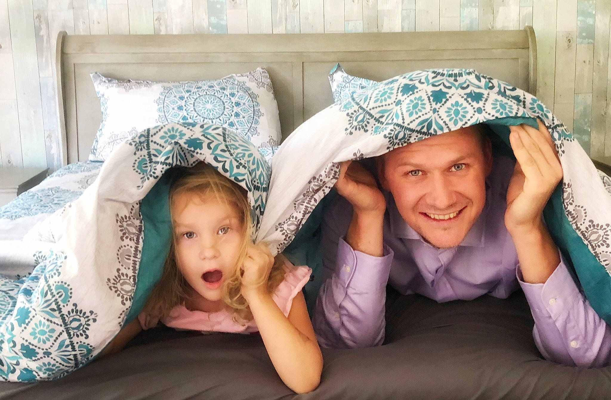 Amber is registered to the contest to win money with this photo: bedding, blanket, comfort, eye, flash_photography, gesture, happy, headwear, joy, laugh, linens, love, mouth, nose, person, stock_photography, surprise, throw_pillow, tooth