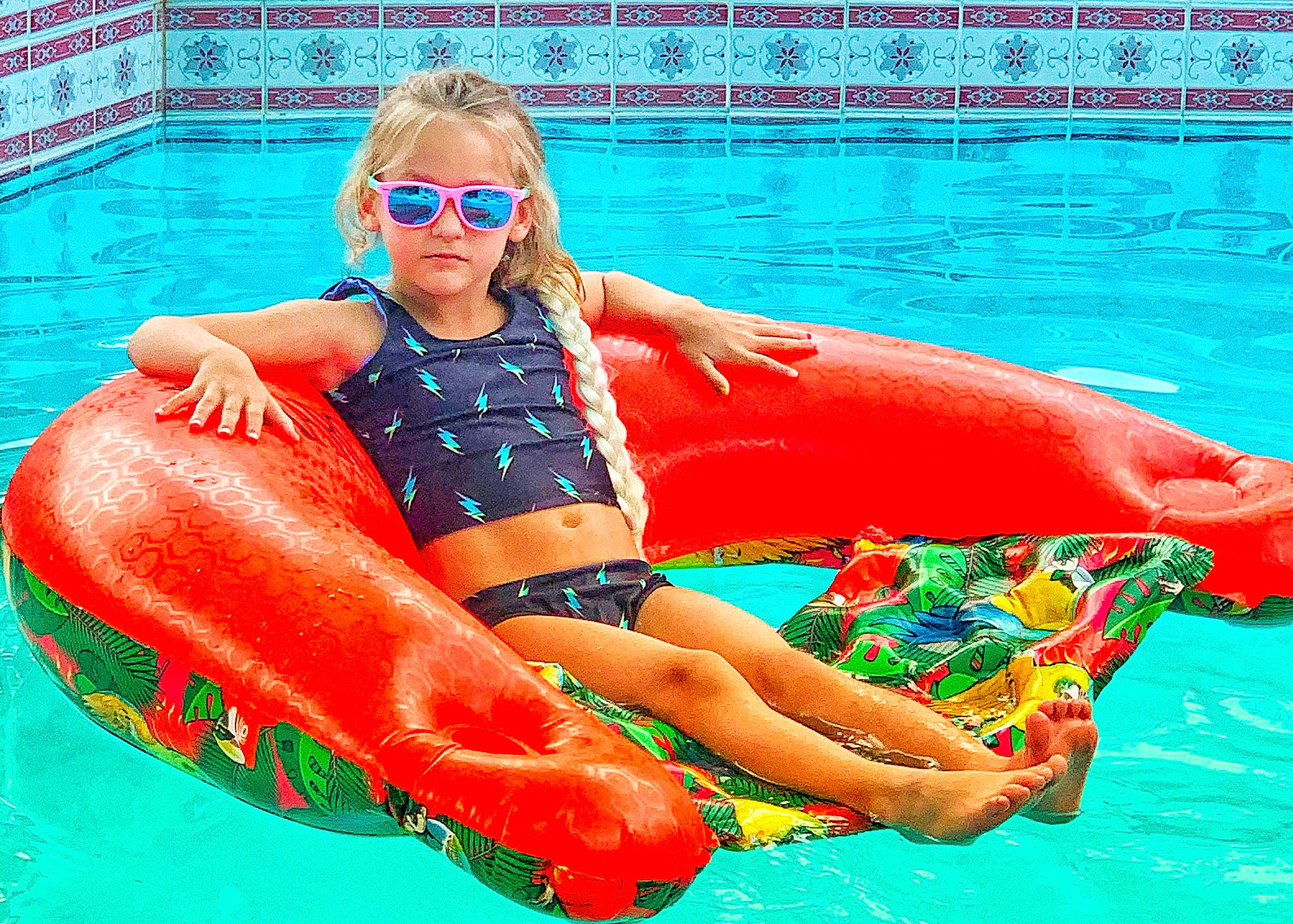 Amber is registered to the contest to win money with this photo: aqua, baby_float, fun, games, goggles, inflatable, leisure, leisure_centre, lifejacket, person, personal_protective_equipment, play, recreation, red, summer, swimming, swimming_pool, tubing, vacation, water_park